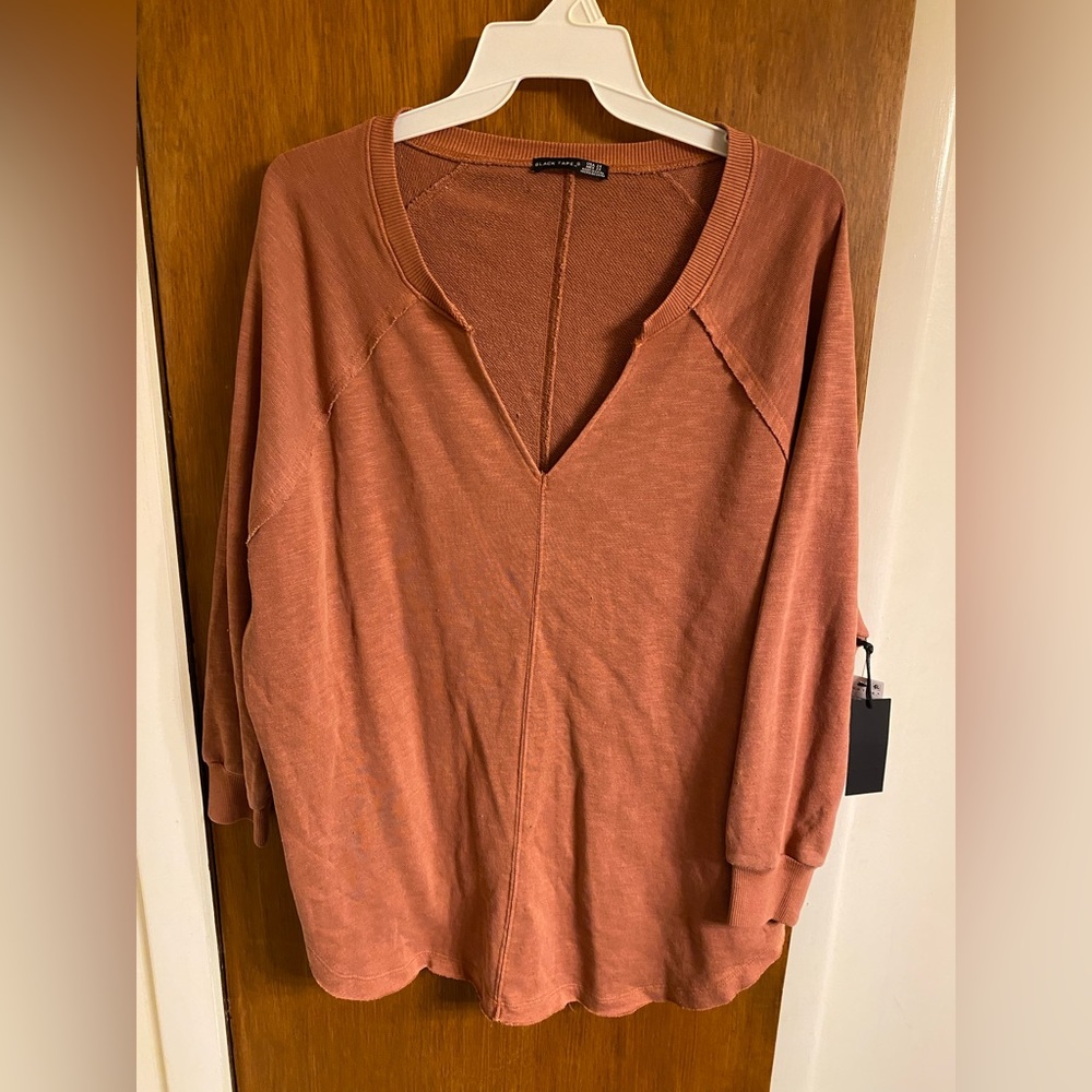 NWT women’s oversized Black Tape sweatshirt in burnt orange.  V-neck, Size 2X.